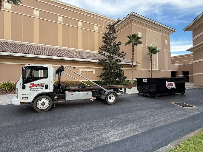 Tampa Bay Junkaneers roll-off dumpster delivery truck commercial property
